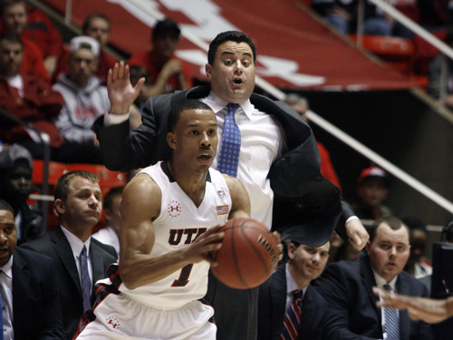 Scott Sommerdorf   |  The Salt Lake Tribune
Arizona head coach Sean Miller reacts as he yells to his team while on defense against Utah while Gabe York looks to pass during first half play. The Arizona Wildcats beat Utah 68-64 in Salt Lake City, Sunday, February 15, 2013.