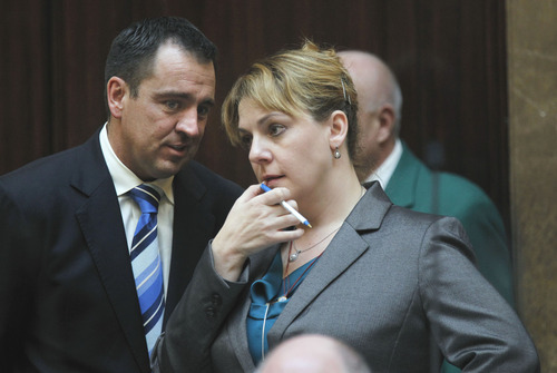 Al Hartmann  |  The Salt Lake Tribune
Minority Leader Jennifer Seelig, D-Salt Lake City, listens to Majority Whip Gregory Hughes, R-Draper, during debate Friday on her HB50, the Dating Violence Protection Act. The measure passed the House with a comfortable margin and now goes to the Senate.