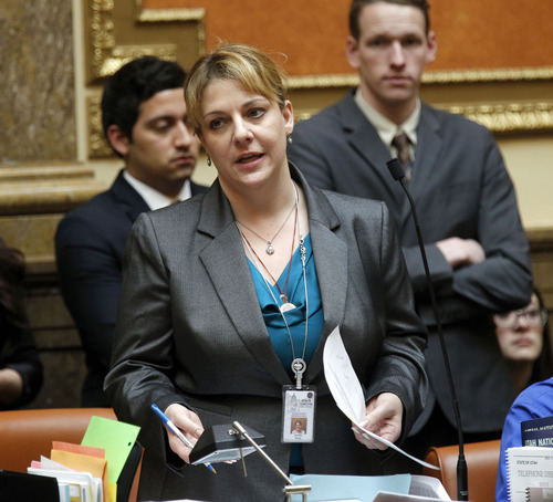 Al Hartmann  |  The Salt Lake Tribune
Minority Leader Jennifer Seelig, D-Salt Lake City, brings up HB50, the Dating Violence Protection Act on the floor of the House on Friday. The bill to grant dating the couples the right to obtain a protective order in the case of assault or threat passed with a wide margin on its way to the House.