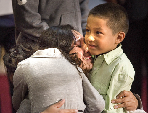Paul Fraughton  |  The Salt Lake Tribune
After speaking at a press conference in Kearns about her struggle to remain in this country and avoid a pending deportation to El Salvador, Ana Cañenguez hugs her two youngest children, Kathy Granda and Luis Granda. Monday, February 18, 2013