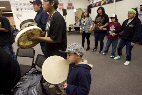 Kim Raff  |  The Salt Lake Tribune
Glen Garcia joins other drummers during a Round Dance, organized by members of the Ute Indian Tribe, at Uinta River High School in Fort Duchesne on Feb. 9, 2013.