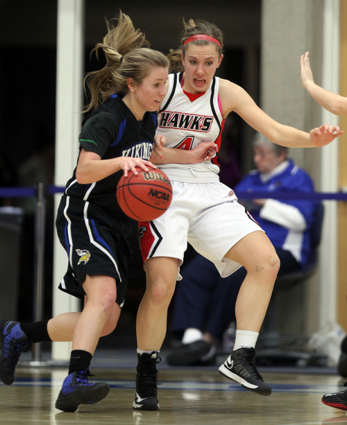 Rick Egan  | The Salt Lake Tribune 

Samantha Staples  defends for Alta, as Megan Wilde drives inside for the Vikings,  in the girls state 5A basketball tournament, Alta vs. Pleasant Grove, in Taylorsville, Monday, February 18, 2013.