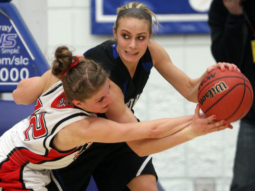 Rick Egan  | The Salt Lake Tribune 

Pleasant Grove's Hailey Albrecht tries to hold onto the ball, as Adrianne Jensen (12)Alta,  reaches in for the ball, in the girls state 5A basketball tournament, Alta vs. Pleasant Grove, in Taylorsville, Monday, February 18, 2013.