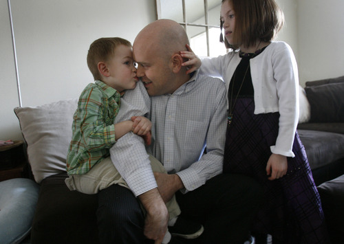 Scott Sommerdorf   |  The Salt Lake Tribune
Matt Duff gets a kiss as he helps his son Jonah, 5, get dressed for church, Sunday, Feb. 3, 2013. Mikelle Duff, 7, is at right. Matt and Kylee Duff were married in the Salt Lake LDS Temple and living happy, Mormon lives until about this time last year, when Matt began to question his faith.