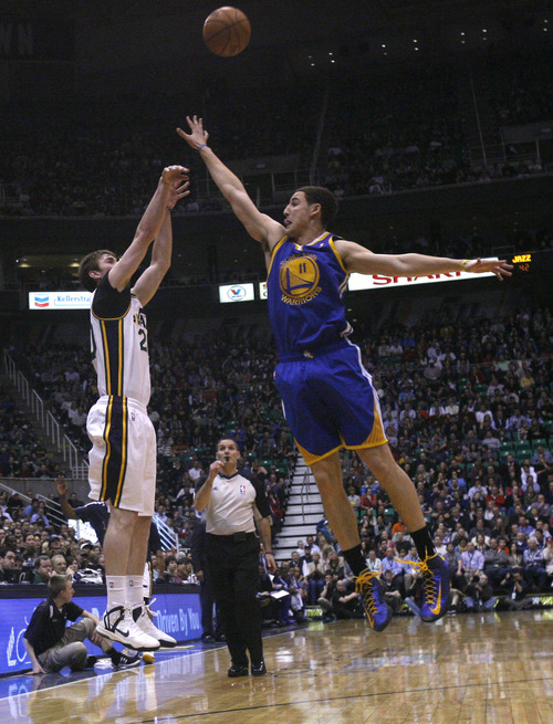 Chris Detrick  |  The Salt Lake Tribune
Utah Jazz shooting guard Gordon Hayward (20) shoots over Golden State Warriors shooting guard Klay Thompson (11) during the first half of the game at EnergySolutions Arena Tuesday February 19, 2013. The Jazz are winning the game 58-53.