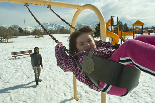Chris Detrick  |  The Salt Lake Tribune
Michael Brennan and his daughter Aila, 3, play on the swings at Sugar House Park Wednesday February 20, 2013.