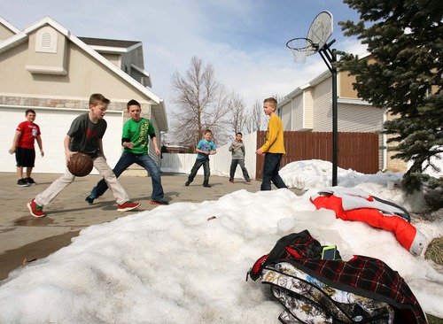 Leah Hogsten  |  The Salt Lake Tribune
"I'm glad, but I'm kinda disappointed," said Hunter Collins, 12, (dribbling ball) of the impending snowstorm expected to hit the Wasatch Front Wednesday evening, Feb. 20, 2013. Collins and his S. Ogden neighborhood pals l-r Braxton Burnett, Bosten Baur, Reilly Collins, Jayven Weakly and Brigham Cox took advantage of the sunny day to play a game of pick-up basketball after school.