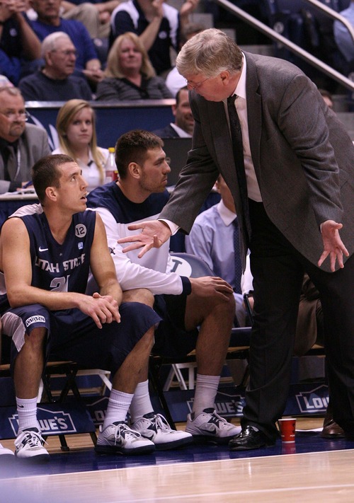 Leah Hogsten  |  The Salt Lake Tribune
Utah State Aggies head coach Stew Morrill has words with Utah State Aggies guard/forward Spencer Butterfield (21) after a foul. Brigham Young University Cougars defeated Utah State University Aggies 70-68 in Provo, February 19, 2013.