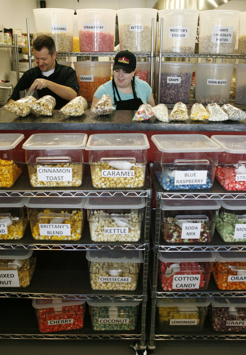 Francisco Kjolseth  |  The Salt Lake Tribune
When it comes to gourmet popcorn, things have come a long way as Scott Roose and Adrienne Glahe fill orders of popcorn at the store in South Jordan. Flavor options go beyond the usual caramel and cheese. At Rooster's Popcorn, owners Scott and Holly Roose offer 60 different flavors both savory and sweet including: loaded baked potato dill pickle, Paremsan garlic, Oreo cookie, white chocolate pretzel, cake batter, cinnamon toast and even soda flavors such as Mountain Dew, Dr. Pepper and Root Beer.
