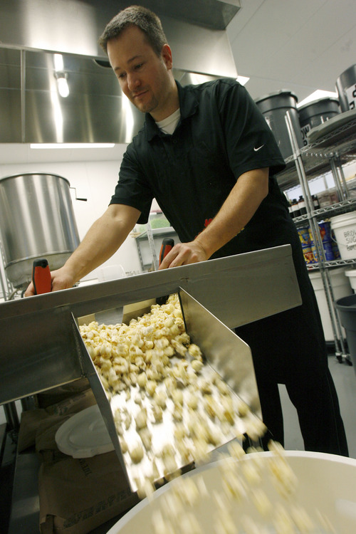Francisco Kjolseth  |  The Salt Lake Tribune
Scott Roose finishes up a batch of vanilla covered popcorn as it cools recently. When it comes to gourmet popcorn, things have come a long way. Flavor options go beyond the usual caramel and cheese. At Rooster's Popcorn in South Jordan, owners Scott and Holly Roose offer 60 different flavors both savory and sweet including: loaded baked potato dill pickle, Paremsan garlic, Oreo cookie, white chocolate pretzel, cake batter, cinnamon toast and even soda flavors such as Mountain Dew, Dr. Pepper and Root Beer.