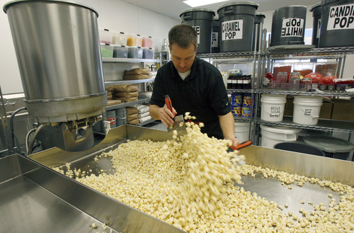 Francisco Kjolseth  |  The Salt Lake Tribune
Scott Roose tosses vanilla covered popcorn as it cools recently. When it comes to gourmet popcorn, things have come a long way. Flavor options go beyond the usual caramel and cheese. At Rooster's Popcorn in South Jordan, owners Scott and Holly Roose offer 60 different flavors both savory and sweet including: loaded baked potato dill pickle, Paremsan garlic, Oreo cookie, white chocolate pretzel, cake batter, cinnamon toast and even soda flavors such as Mountain Dew, Dr. Pepper and Root Beer.