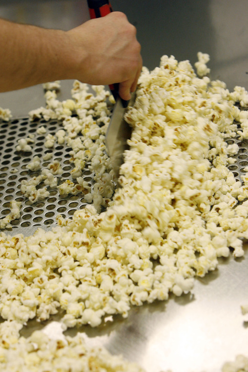Francisco Kjolseth  |  The Salt Lake Tribune
It all starts with straight up popped popcorn before Scott Roose whips it up into a plethora of gourmet flavors that have come a long way. Flavor options go beyond the usual caramel and cheese. At Rooster's Popcorn in South Jordan, owners Scott and Holly Roose offer 60 different flavors both savory and sweet including: loaded baked potato dill pickle, Paremsan garlic, Oreo cookie, white chocolate pretzel, cake batter, cinnamon toast and even soda flavors such as Mountain Dew, Dr. Pepper and Root Beer.