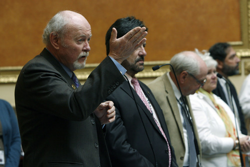 Francisco Kjolseth  |  The Salt Lake Tribune
Standing in ovation, Rep. Larry Wiley, D-West Valley City, thanks the veterans gathered at the Utah State Capitol representing all branches of the military as he states "I'm a proud Vietnam Veteran and I'm standing here today because of the vets here." Rep. Curt Oda, R-Clearfield, proposed HCR6 as a resolution recognizing the 50th anniversary of the Vietnam War. He said it was a way to "finally welcome them home."
