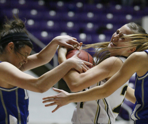 Rick Egan  | The Salt Lake Tribune 

Dixie's Caroline Lantor (23) goes for a loose ball, along with Desert Hill's Whitney Atkin (24) in the 3A girls state championship game, Dixie vs. Desert Hills,  in Ogden, Saturday, February 23, 2013