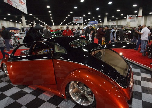 Leah Hogsten  |  The Salt Lake Tribune
Mike Ferriera's 1937 Five-window Ford Coupe drew a lot of attention.  Over 300 custom cars, classics, hot rods, trucks, motorcycles and race cars are on display at The 39th Annual Parts Plus Autorama at the South Towne Expo Center, February 23, 2013. The show ends Sunday, February 24, 2013