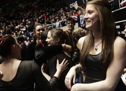 Kim Raff  |  The Salt Lake Tribune
University of Utah gymnast Lia Del Priore gets hugs from teammates after scoring a perfect 10 on her floor routine during a meet against Stanford at the Huntsman Center in Salt Lake City on February 23, 2013.