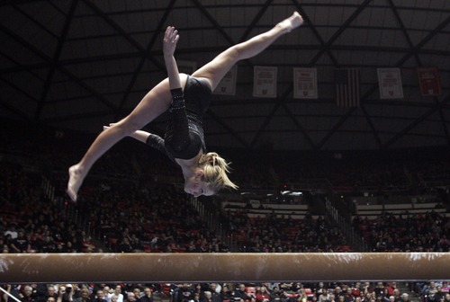 Kim Raff  |  The Salt Lake Tribune
University of Utah gymnast Mary Beth Lofgren performs a beam routine during a meet against Stanford at the Huntsman Center in Salt Lake City on February 23, 2013.