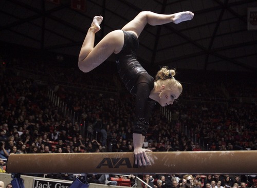 Kim Raff  |  The Salt Lake Tribune
University of Utah gymnast Georgia Dabritz performs a beam routine during a meet against Stanford at the Huntsman Center in Salt Lake City on February 23, 2013.
