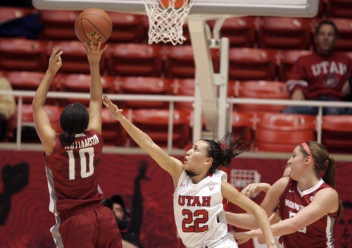 Kim Raff  |  The Salt Lake Tribune
University of Utah player (right) Danielle Rodriguez defends Washington State player (left) Alexas Williamson as she shoots the ball during a game at the Huntsman Center in Salt Lake City on February 24, 2013. Utah went on to win 59-47.