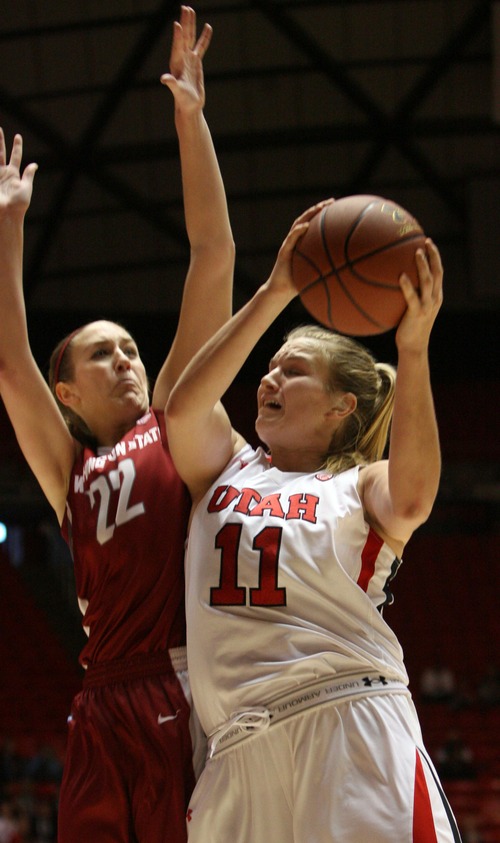 Kim Raff  |  The Salt Lake Tribune
University of Utah player (right) Taryn Wicijowski shoots the ball and is fouled by Washington State player (left) Sage Romberg during a game at the Huntsman Center in Salt Lake City on February 24, 2013. Utah went on to win 59-47.