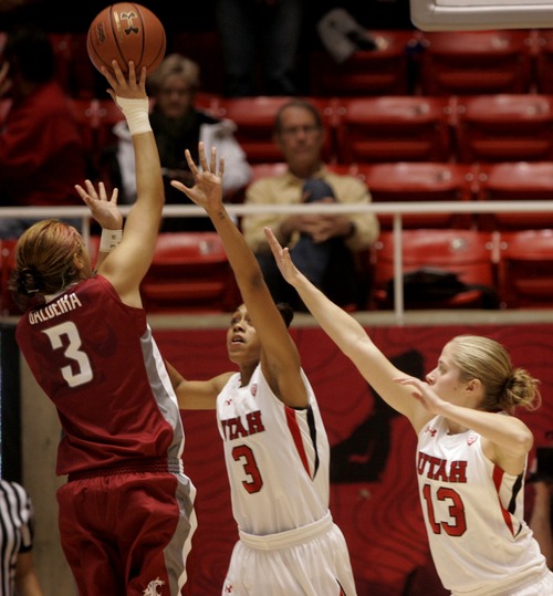 Kim Raff  |  The Salt Lake Tribune
University of Utah players (right) Rachel Messer and (middle) Iwalani Rodrigues defend Washington State player (left) Lia Galdeira as she shoots the ball during a game at the Huntsman Center in Salt Lake City on February 24, 2013. Utah went on to win 59-47.