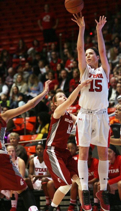 Kim Raff  |  The Salt Lake Tribune
University of Utah player (right) Michelle Plouffe shoots a three as Washington State player (left) Sage Romberg defends during a game at the Huntsman Center in Salt Lake City on February 24, 2013. Utah went on to win 59-47.