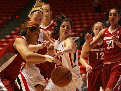 Kim Raff  |  The Salt Lake Tribune
University of Utah player (middle) Chelsea Bridgewater competes with Washington State players (left) Lia Galdeira for a loose ball during a game at the Huntsman Center in Salt Lake City on February 24, 2013. Utah went on to win 59-47.