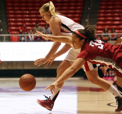 Kim Raff  |  The Salt Lake Tribune
University of Utah player (left) Taryn Wicijowski competes with Washington State players (right) Mariah Cooks for a loose ball during a game at the Huntsman Center in Salt Lake City on February 24, 2013. Utah went on to win 59-47.