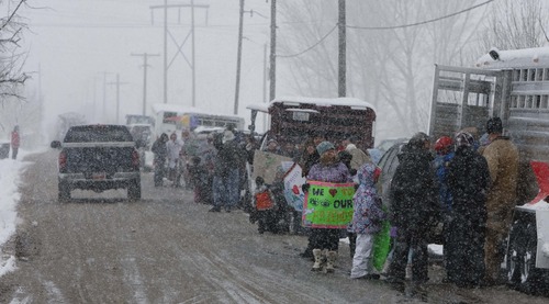 Leah Hogsten  |  The Salt Lake Tribune
SaveFarmington.org, a citizens group in Farmington, held a rally to protest the proposed West Davis Corridor, February 23, 2013. More than 100 people lined Glovers Lane in Farmington for the milelong protest made up of farm equipment, airboats, bikes and citizens with the message: STOP UDOT from building West Davis Corridor through Farmington Bay area.