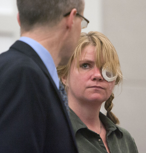 Steve Griffin | The Salt Lake Tribune
Kristine Biggs, who was shot in the eye by a Morgan County police officer after leading them on a chase, talks with her attorney, Michael Edwards, during her sentencing hearing for charges related to the incident at the Davis County Justice Complex in Farmington, Utah Monday February 25, 2013.