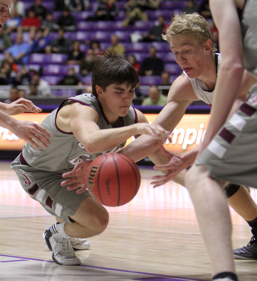 Francisco Kjolseth  |  The Salt Lake Tribune
Jordan's Marcus Gutierrez tries to regain control of the ball over American Fork at the Dee Events Center at Weber State on Monday, February 25, 2013.