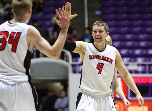 Rick Egan  | The Salt Lake Tribune 

 Taylor Rawson (34) big-fives Dan Nyman (4) as the Caveman celebrate their narrow victory over the Beat Diggers, in prep 5A state tournament action American Fork vs. Jordan, at the Dee Event Center in Ogden, Monday, February 25, 2013.