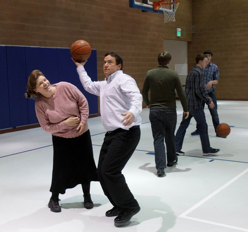 Trent Nelson  |  The Salt Lake Tribune
William E. Jessop puts up a basketball shot over his wife Joanna Jessop as a group of FLDS members gather to recreate at El Capitan High School, Sunday, February 17, 2013 in Colorado City.