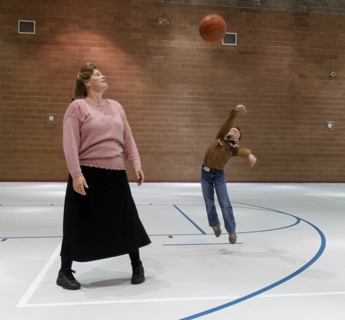 Trent Nelson  |  The Salt Lake Tribune
Nathan Jessop launches a shot while his mother Joanna Jessop looks on as a group of FLDS members gather to recreate at El Capitan School, Sunday, February 17, 2013 in Colorado City.