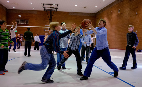 Trent Nelson  |  The Salt Lake Tribune
Boys race for a loose basketball as a group of FLDS members recreate at El Capitan School, Sunday, February 17, 2013 in Colorado City.