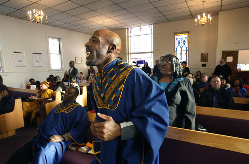Scott Sommerdorf  |  The Salt Lake Tribune
Trinity AME Church choir member Kevin Nelson claps and moves to the music of the Ebenezer Church of God in Christ choir along with the rest of the congregation at Trinity AME Church in Salt Lake City during Founders Day service Sunday, February 23, 2013.