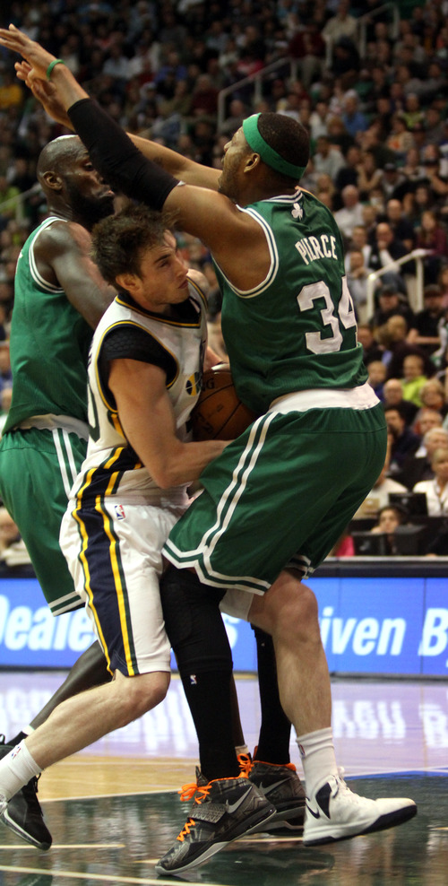 Rick Egan  | The Salt Lake Tribune 

Utah Jazz shooting guard Gordon Hayward (20) is fouled by Boston Celtics small forward Paul Pierce (34), in NBA action at the EnergySolutions Arena,  Monday, February 25, 2013.