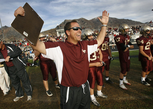 Scott Sommerdorf  l  The Salt Lake Tribune
Lone Peak High School football Tony McGeary resigned this week amid financial mismanagement allegations.  He is seen here celebrating a play by his defense late in a game against Syracuse on Oct. 29, 2010.