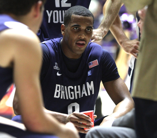 Rick Egan  | The Salt Lake Tribune 

Brigham Young Cougars forward Brandon Davies (0) takes a breather during a time out, Davies had 18 points in the first half, in basketball action, BYU vs. Weber State, in Ogden, Saturday, December 15, 2012.