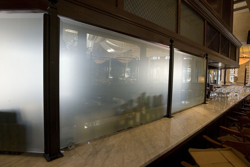 Paul Fraughton  |  The Salt Lake Tribune 
Conforming to Utah's most current liquor laws, a frosted glass curtain hides a portion of the bar at Brio Tuscan Grille at Fashion Place Mall.