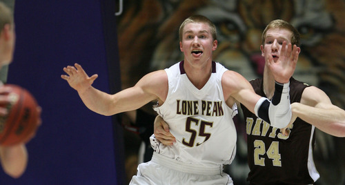 Steve Griffin | The Salt Lake Tribune


Lone Peak's Eric Mika sticks his tongue out as he looks for the ball as he posts up Davis high's Elijah Kletzli during 5A state basketball tournament game at the Dee Events Center in Ogden, Utah Wednesday February 27, 2013.