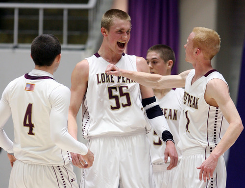 Steve Griffin | The Salt Lake Tribune


Lone Peak's T.J. Haws gives teammate, Eric Mika  a forearm in the chest after the 6'10" center scored and was fouled during the 5A state basketball game against Davis at the Dee Events Center in Ogden, Utah Wednesday February 27, 2013.