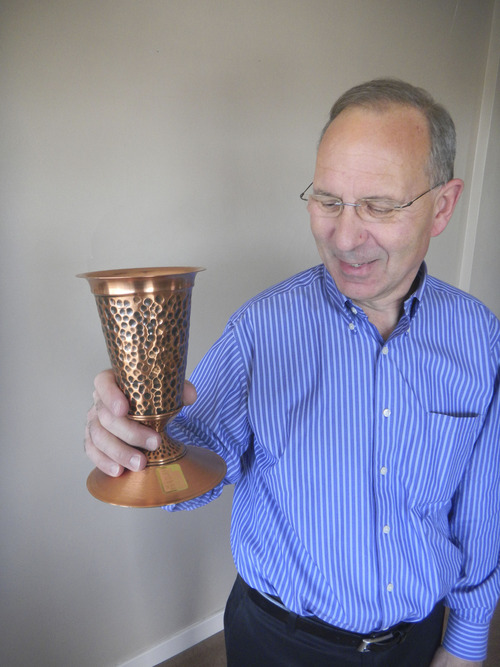 Tom Wharton  |  The Salt Lake Tribune
Bill Ganz of Midvale shows off a copper vase he spun at his workshop.