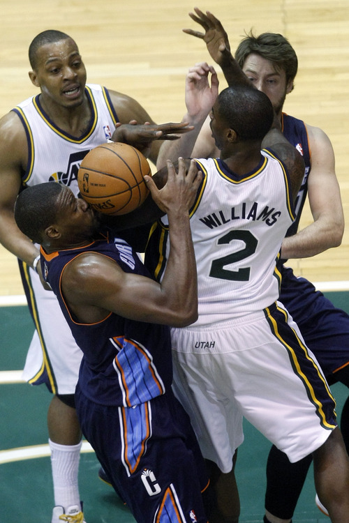Chris Detrick  |  The Salt Lake Tribune
Charlotte Bobcats small forward Jeff Adrien (4) Utah Jazz power forward Marvin Williams (2) Charlotte Bobcats power forward Josh McRoberts (11) and Utah Jazz point guard Randy Foye (8) fight for a rebound during the first half of the game at EnergySolutions Arena Friday March 1, 2013.
