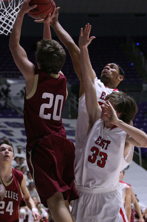 Leah Hogsten  |  The Salt Lake Tribune
East's John Fakahafua tries to swat Logan's Jaxton Andersen. Logan High School defeated East High School 66-62 during their 4A State Basketball  quarterfinal game at Dee Events Center in Ogden, Thursday, February 28, 2013.