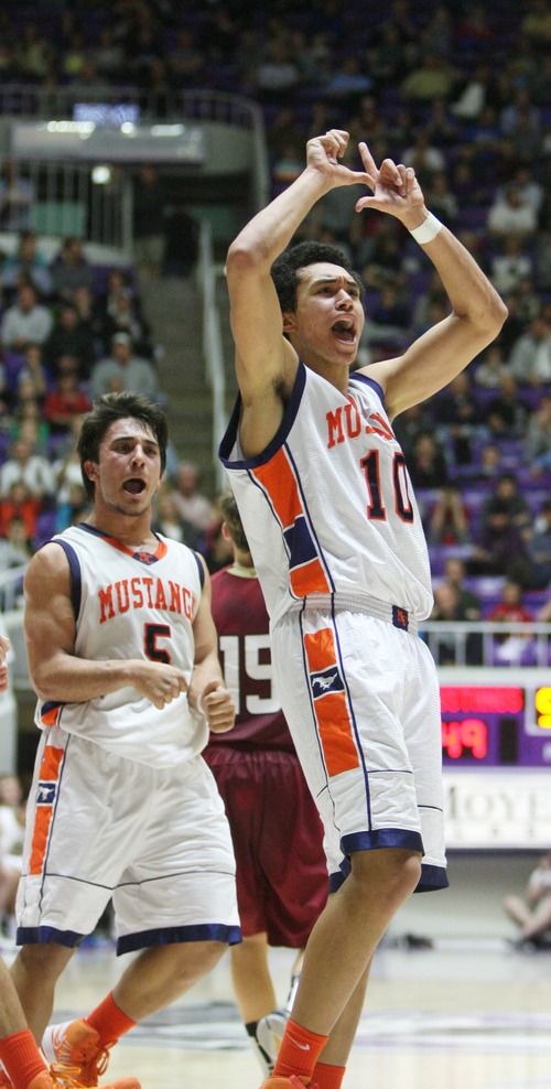 Kim Raff  |  The Salt Lake Tribune
Mountain Crest's Faimafili Laulu-Pututau celebrates scoring a basket and a foul to take the lead over Logan during the 4A state semifinal game at the Dee Event Center in Ogden on March 1, 2013. Mountain Crest went on to win 54-51.