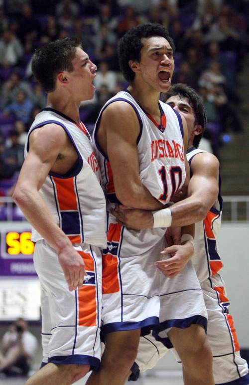 Kim Raff  |  The Salt Lake Tribune
Mountain Crest's Faimafili Laulu-Pututau celebrates scoring a basket and a foul to take the lead over Logan during the 4A state semifinal game at the Dee Event Center in Ogden on March 1, 2013. Mountain Crest went on to win 54-51.