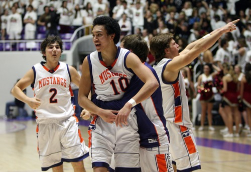 Kim Raff  |  The Salt Lake Tribune
Mountain Crest players celebrate defeating Logan 54-51during the 4A state semifinal game at the Dee Event Center in Ogden on March 1, 2013.
