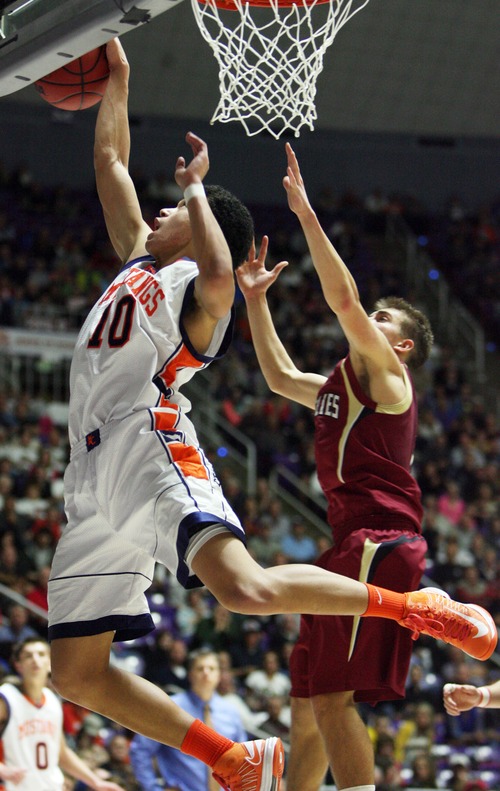 Kim Raff  |  The Salt Lake Tribune
(left) Mountain Crest's Faimafili Laulu-Pututau rebounds the ball during the 4A state semifinal game against Logan at the Dee Event Center in Ogden on March 1, 2013. Mountain Crest went on to win 54-51.