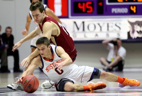 Kim Raff  |  The Salt Lake Tribune
(bottom) Mountain Crest's Tyler Crosbie competes with (top) Logan's Dallin Dahl for a loose ball during the 4A state semifinal game at the Dee Event Center in Ogden on March 1, 2013. Mountain Crest went on to win 54-51.
